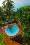 Couple enjoying hot tub at Fregate Resort, Seychelles