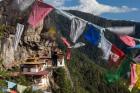 Bhutan, Paro Prayer Flags Fluttering At The Cliff's Edge Across From Taktsang Monastery, Or Tiger's Nest