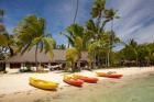 Kayak on the beach, and waterfront bure, Plantation Island Resort, Malolo Lailai Island, Mamanuca Islands, Fiji