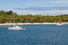 Little sailboat in the blue lagoon, Yasawa, Fiji, South Pacific