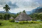 Traditional thatched roofed huts in Navala, Fiji, South Pacific