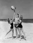 1950s Teens Jumping For Beach Ball