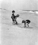 3 Kids Playing In The Sand On The New Jersey Shore