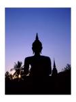 Silhouette of Buddha and temple during sunset, Sukhothai, Thailand