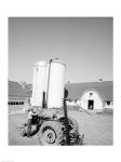 USA, Farmer Working on Tractor, Agricultural Buildings in the Background