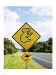 Close-up of animal crossing sign on a roadside, Australia