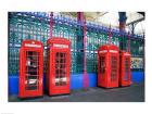 Four telephone booths near a grille, London, England