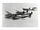 Four fighter planes in flight, P-38 Lightning