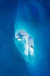 Antarctica, Iceberg framed in arch of another in Wilhelmina Bay. | Obraz na stenu