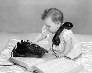 1960s Baby Girl With Telephone Book | Obraz na stenu