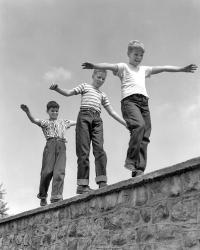 1950s Three Laughing Boys Walking On Top Of Stone Wall | Obraz na stenu