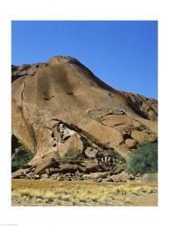 Tourists climbing on a rock, Ayers Rock, Uluru-Kata Tjuta National Park, Australia | Obraz na stenu